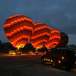 Hot balloon Marrakech soaring over the High Atlas Mountains, offering breathtaking views of the city and desert landscapes. Experience a sunrise air balloon Marrakech adventure with Atlasballooning for unforgettable panoramas.