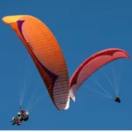 Parapent Marrakech flying over Atlas mountains with panoramic view, adventure activity in Marrakech sky